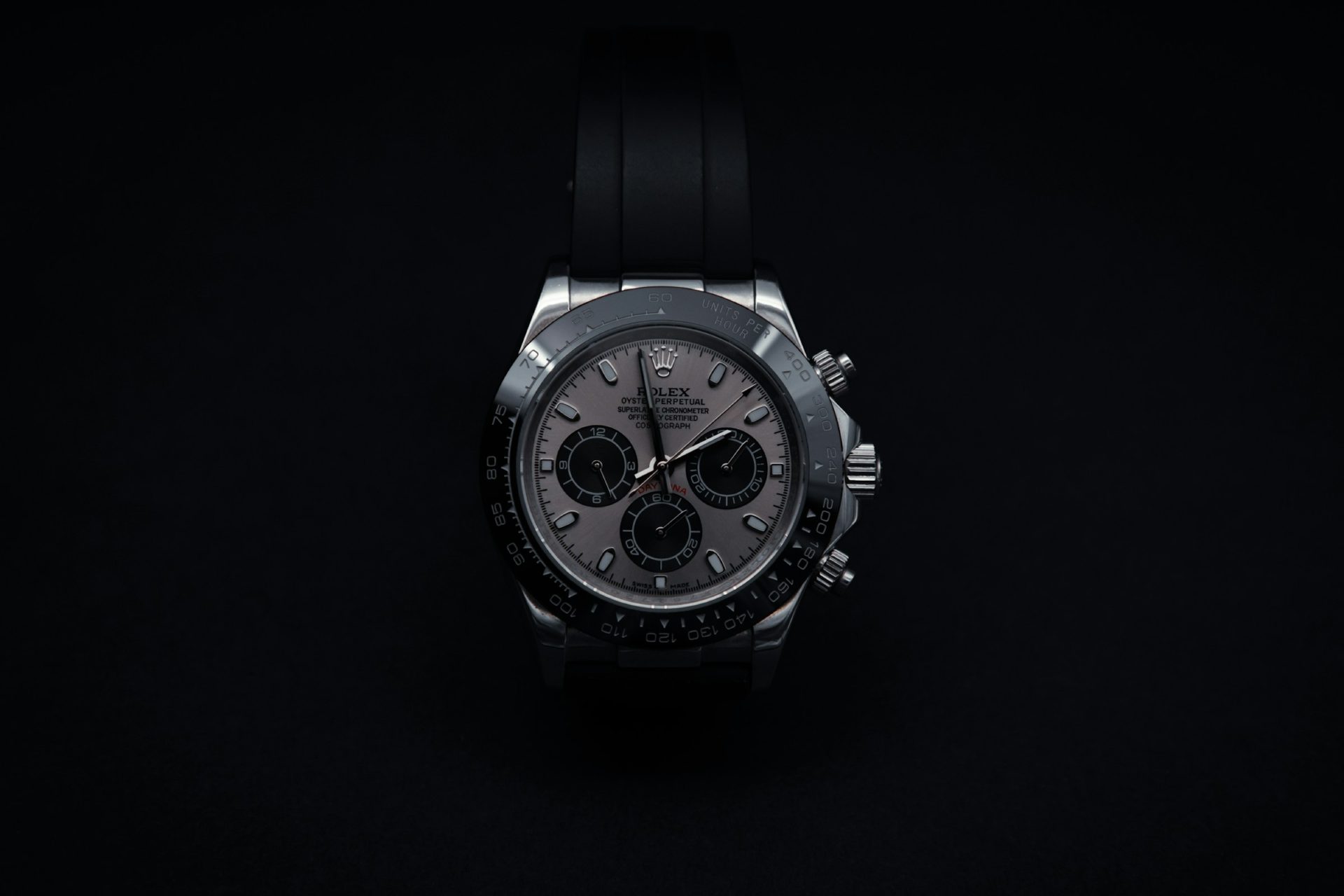 Silver chronograph in a soft spotlight on a black background